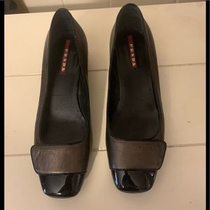 Prada Patent and bronze leather shoes.